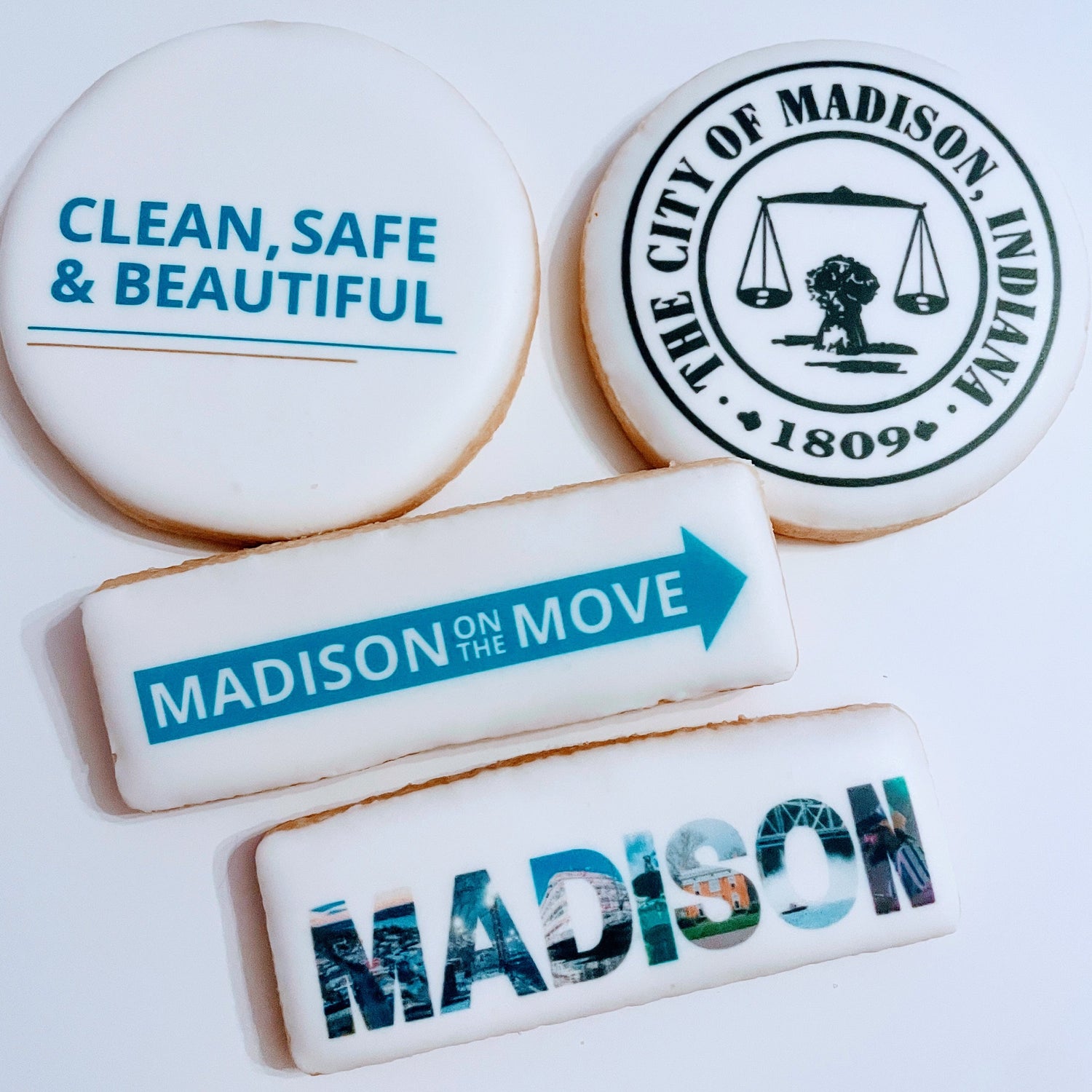 Decorative cookies with text and logos, including 'Clean, Safe & Beautiful' and 'Madison on the Move'.